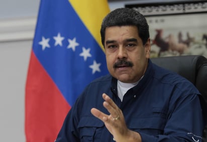 'Hablamos de la cooperación, la cooperación militar que va muy bien y va a mejorar, la cooperación industrial, ya comienzan a funcionar en Venezuela cinco industrias, cinco fabricas de camiones', dijo Maduro desde Caracas a través de la televisora estatal VTV. (ARCHIVO)

