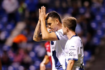 Daniel Arreola, del Puebla, en festejo después del segundo gol de su equipo durante el partido de anoche. Puebla vence a un Atlas inofensivo