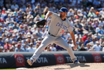 Cole Hamels no aceptó carreras en 7 entradas y produjo dos rayitas en la victoria de Cachorros ante Rockies. (AP)