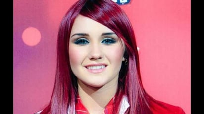 Otra cara. Soledad y depresión experimentó la cantante Dulce María cuando fue parte del grupo RBD. (ESPECIAL)