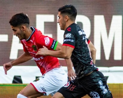 Después de más de dos semanas sin disputar un partido a causa de un brote de 30 casos de COVID-19, los Xolos de Tijuana derrotaron este miércoles por 2-1 al Juárez en partido pospuesto de la undécima jornada del Guard1anes 2020. (CORTESÍA)