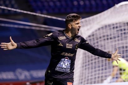 Emmanuel Gigliotti celebra luego de marcar el primer tanto, en la victoria de León 2-1 sobre el Puebla. (JAM MEDIA)