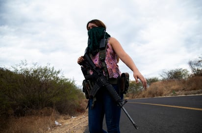 Las vigilantes rechazan las afirmaciones de que sean parte de una organización delictiva. (AP)