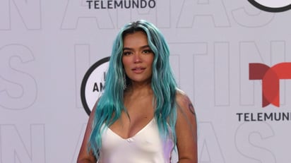 Karol G y Camilo recibieron el jueves los primeros premios de la noche en los Latin American Music Awards, que volvieron en una 6ta edición totalmente presencial y en vivo tras haberse cancelado el año pasado debido a la pandemia. (AP)
