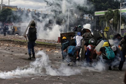 Los manifestantes han montado barricadas en algunas zonas periféricas. (AP) 