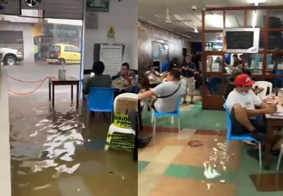 El momento que quedó registrado por las personas que se encontraban en el bar al momento de la inundación, se viralizó rápidamente en redes sociales (CAPTURA) 