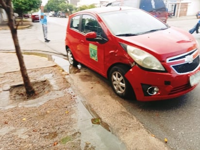 Chevrolet Spark, modelo 2012, color rojo. (EL SIGLO DE TORREÓN)