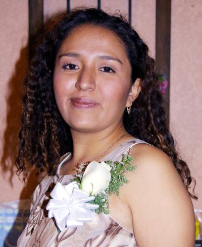  13 de diciembre  
Señorita Marcela Martínez Ceniceros en la despedida de soltera que se le ofreció en días pasados.