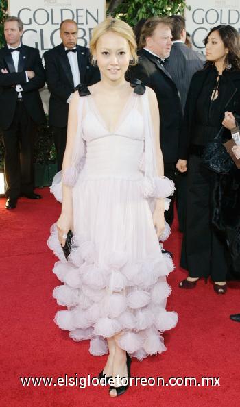 Rinko Kikuchi lució un vestido color  rosa palo.