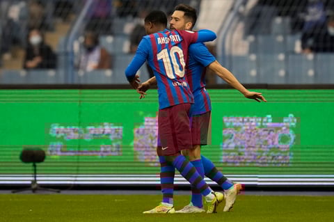Barcelona's players celebrate a goal during the Spanish Super Cup semi final soccer match between Barcelona and Real Madrid at King Fahd stadium in Riyadh, Saudi Arabia, Wednesday, Jan. 12, 2022. (AP Photo/Hassan Ammar)