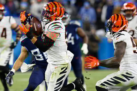 Cincinnati Bengals linebacker Logan Wilson (55) intercepts the ball against the Tennessee Titans during the second half of an NFL divisional round playoff football game, Saturday, Jan. 22, 2022, in Nashville, Tenn. The Cincinnati Bengals won 19-16. (AP Photo/Mark Zaleski)
