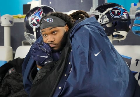 Tennessee Titans running back D'onta Foreman sits on the bench after the team's 19-16 loss to the Cincinnati Bengals in an NFL football AFC divisional playoff game Saturday, Jan. 22, 2021, in Nashville, Tenn. (George Walker IV/The Tennessean via AP)