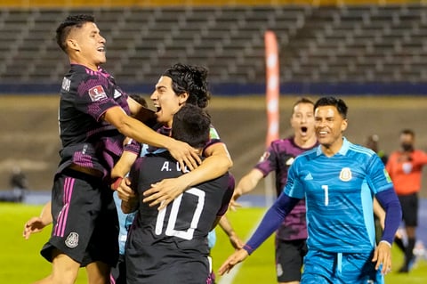 Mexico's Alexis Vega (10) celebrates with teammates after scoring his side's second goal against Jamaica during a qualifying soccer match for the FIFA World Cup Qatar 2022 in Kingston, Jamaica, Thursday, Jan. 27, 2022. (AP Photo/Ramon Espinosa)