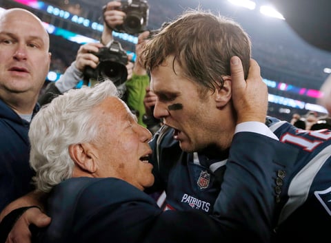 FILE - New England Patriots owner Robert Kraft, left, embraces quarterback Tom Brady after defeating the Jacksonville Jaguars in the AFC championship NFL football game, Sunday, Jan. 21, 2018, in Foxborough, Mass. The Patriots won 24-20. Tom Brady has retired after winning seven Super Bowls and setting numerous passing records in an unprecedented 22-year-career. He made the announcement, Tuesday, Feb. 1, 2022, in a long post on Instagram. (AP Photo/Winslow Townson, File)