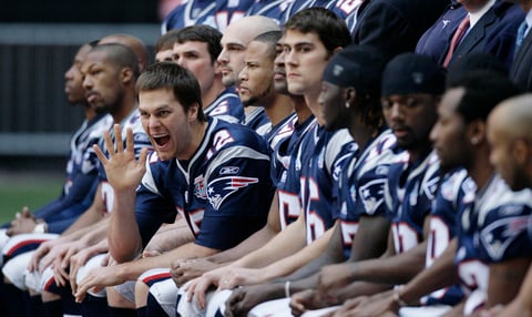 New England Patriots quarterback Tom Brady waves during the team's  picture at the walk through at University of Phoenix Stadium on Saturday, Feb. 2, 2008 in Glendale, Ariz. The Patriots will play the New York Giants in the Super Bowl XLII football game on Sunday, Feb. 3.  (AP Photo/Stephan Savoia)
