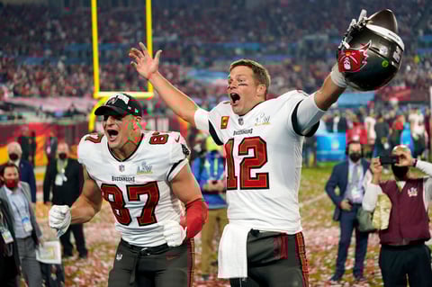 FILE - Tampa Bay Buccaneers tight end Rob Gronkowski, left, and quarterback Tom Brady (12) celebrate after the NFL Super Bowl 55 football game against the Kansas City Chiefs in Tampa, Fla., Feb. 7, 2021. Tom Brady has retired after winning seven Super Bowls and setting numerous passing records in an unprecedented 22-year-career. He made the announcement, Tuesday, Feb. 1, 2022, in a long post on Instagram. (AP Photo/Steve Luciano, File)