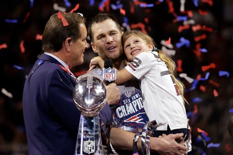 FILE - New England Patriots' Tom Brady holds his daughter, Vivian, after the NFL Super Bowl 53 football game against the Los Angeles Rams, Sunday, Feb. 3, 2019, in Atlanta. Tom Brady has retired after winning seven Super Bowls and setting numerous passing records in an unprecedented 22-year-career. He made the announcement, Tuesday, Feb. 1, 2022, in a long post on Instagram.  (AP Photo/Mark Humphrey, File)