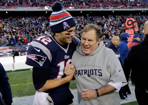 FILE - New England Patriots quarterback Tom Brady, left, celebrates with head coach Bill Belichick after defeating the Miami Dolphins 41-13 in an NFL football game Sunday, Dec. 14, 2014, in Foxborough, Mass. Tom Brady has retired after winning seven Super Bowls and setting numerous passing records in an unprecedented 22-year-career. He made the announcement, Tuesday, Feb. 1, 2022, in a long post on Instagram. (AP Photo/Charles Krupa, File)