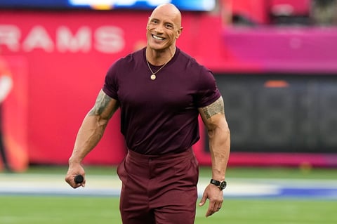 Dwayne 'The Rock' Johnson smiles before the NFL Super Bowl 56 football game between the Los Angeles Rams and the Cincinnati Bengals, Sunday, Feb. 13, 2022, in Inglewood, Calif. (AP Photo/Chris O'Meara)