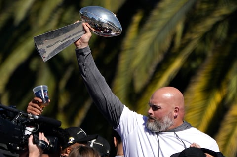 Los Angeles Rams offensive lineman Andrew Whitworth holds up the Vince Lombardi Super Bowl trophy during the team's victory parade in Los Angeles, Wednesday, Feb. 16, 2022, following their win Sunday over the Cincinnati Bengals in the NFL Super Bowl 56 football game. (AP Photo/Marcio Jose Sanchez)
