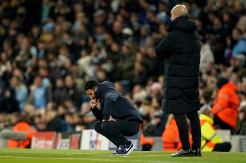 Sporting's head coach Ruben Amorim, center, reacts during the Champions League round of 16 second leg soccer match between Manchester City and Sporting Lisbon at the City of Manchester Stadium in Manchester, England, Wednesday, March 9, 2022. (AP Photo/Dave Thompson)