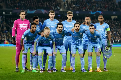 Manchester City squad pose ahead of the Champions League round of 16 second leg soccer match between Manchester City and Sporting Lisbon at the City of Manchester Stadium in Manchester, England, Wednesday, March 9, 2022. (AP Photo/Dave Thompson)