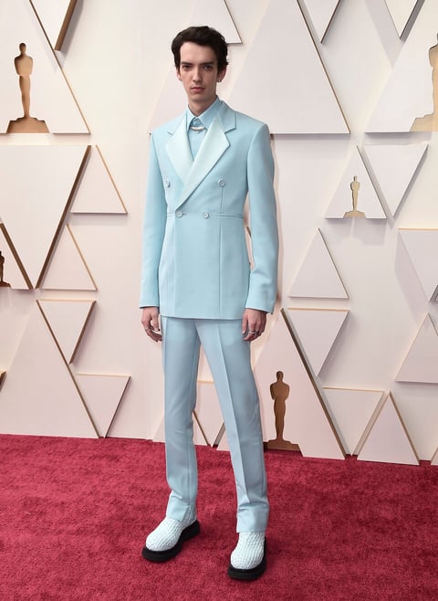 Kodi Smit-McPhee arrive at the Oscars on Sunday, March 27, 2022, at the Dolby Theatre in Los Angeles. (Photo by Jordan Strauss/Invision/AP)