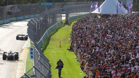 Spectators watch the Australian Formula One Grand Prix in Melbourne, Australia, Sunday, April 10, 2022. (AP Photo/Asanka Brendon Ratnayake)