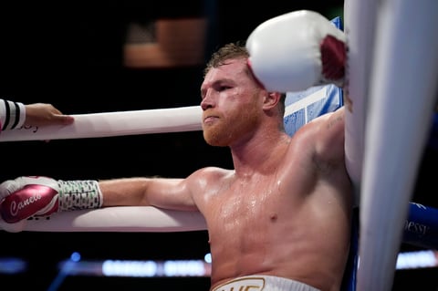 Canelo Alvarez, of Mexico, sits in his corner during a light heavyweight title fight against Dmitry Bivol, of Kyrgyzstan, Saturday, May 7, 2022, in Las Vegas. (AP Photo/John Locher)