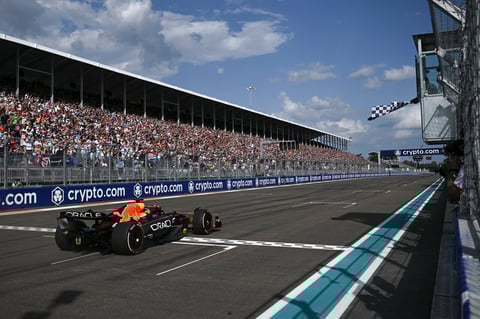 Red Bull driver Max Verstappen of the Netherlands crosses the finish line under the checkered flag to win the Formula One Miami Grand Prix auto race at Miami International Autodrome, Sunday, May 8, 2022, in Miami Gardens, Fla. (AFP, Brendan Smialowski via Pool)