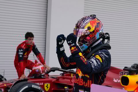 Red Bull driver Max Verstappen of the Netherlands celebrates after winning the Formula One Miami Grand Prix auto race over second placer finisher Ferrari driver Charles Leclerc of Monaco, left, at the Miami International Autodrome, Sunday, May 8, 2022, in Miami Gardens, Fla. (AP Photo/Darron Cummings)