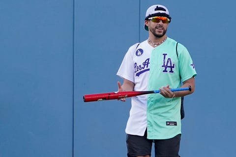 Rapper and Singer Bad Bunny walks in the outfield during the MLB All Star Celebrity Softball game, Saturday, July 16, 2022, in Los Angeles. (AP Photo/Mark J. Terrill)
