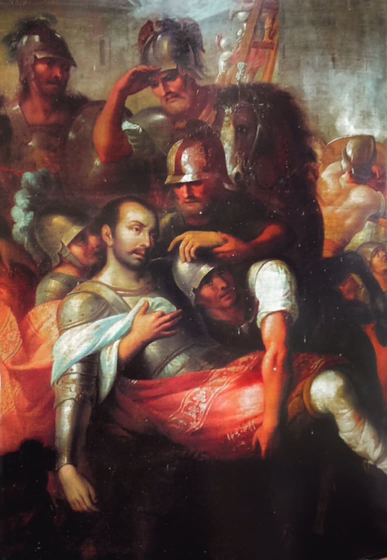 San Ignacio herido trasladado del sitio de Pamplona a Loyola. Combatiendo contra el ejército invasor de Francisco I rey de Francia, en el ejercito del duque de Nájera, una bala de cañón le causó una grave herida en la pierna derecha.
