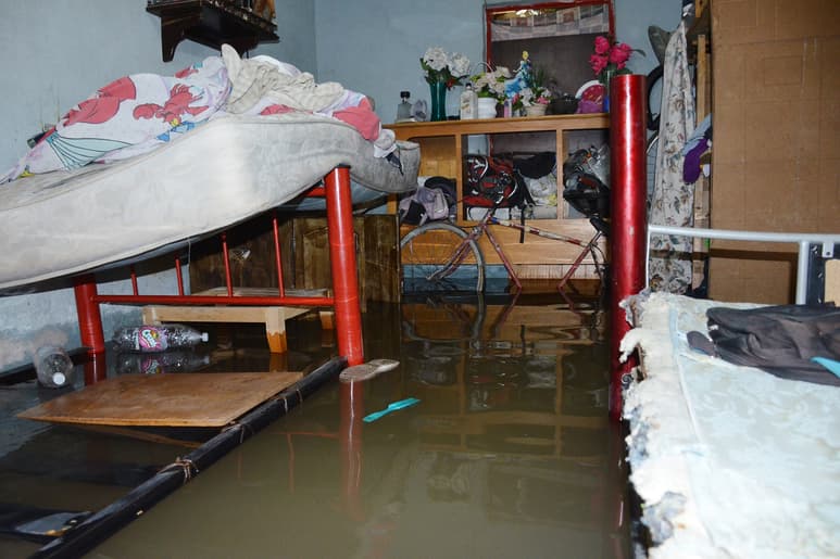 Grave. En la calzada División del Norte, Provitec y Carmen Romano, así entró el agua a las casas. (FERNANDO COMPEÁN)