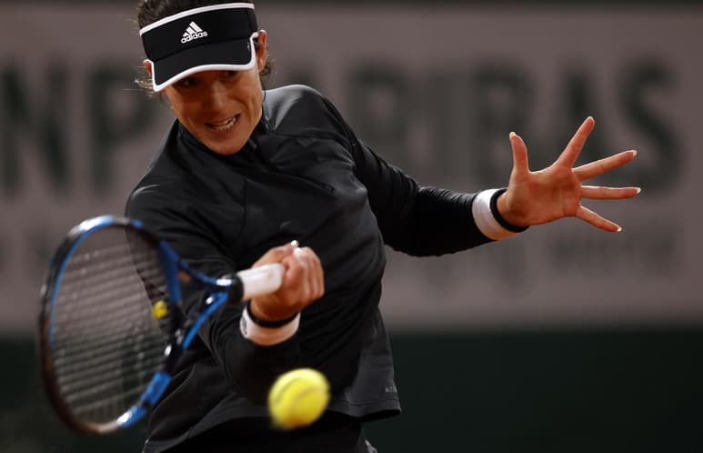 Garbiñe Muguruza no pudo avanzar a los octavos de final, luego de perder 7-5, 2-6, 6-4 ante Danielle Collins. (EFE)