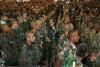 Un atronador aplauso dieron los 855 paramilitares tras escuchar sendos mensajes de saludo grabados en un vídeo desde sus escondites por los jefes político y militar de las AAUC, Carlos Castaño y Salvatore Mancuso, respectivamente, así como por el principal promotor del BCN Adolfo Paz, más conocido como 'Don Berna'.
