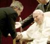 2001-Thousands of wellwishers greet Pope John Paul II as he arrives at the Roman Catholic Patriarch in Damascus in this May 7, 2001