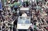 2001file photo of pope john paul ii gesturing from the balcony of his summer residence in castelgandolfo, alongside u.s. president george w. bush north of rome, on july 23, 2001
