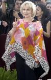 Fey llegó ataviada con un elegante y fresco vestido blanco, lució sonriente y feliz.