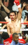 Pacquiao nuevamente sacudió a Márquez hacia el final del combate en en el que probablemente fue uno de los asaltos mejor disputados del año, pero no pudo liquidar a su rival mexicano.