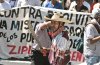 Integrantes de la Coordinadora Nacional de Trabajadores de la Educación (CNTE) y del Frente Estatal contra la Represión marcharon  en Michoacán, en protesta por la iniciativa de reforma energética.