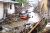 Las lluvias dejaron alrededor de mil viviendas dañadas, tres puentes destruidos, un tren carguero descarrilado y al menos 15 cadáveres del panteón municipal fueron arrastrados.