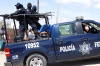 De acuerdo con la Secretaría de Seguridad Pública Federal, agentes municipales protegían a sujetos que llevaban droga en una camioneta.