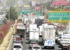 Severo caos vial en la carretera a Chapala, a la altura del Periférico, provoca el paro de transportistas afiliados a la CONATRAM.
