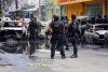 Dos presuntos sicarios murieron calcinados dentro de un vehículo en medio de un enfrentamiento entre un comando y policías federales en el estado de Veracruz.