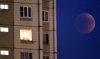 El eclipse total de luna visto desde la Esplanada dos Ministerios en Brasilia (Brasil).