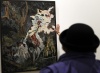 Un visitante observa el cuadro del artista norteamericano Hernan Bas titulado 'La Inmaculada lactancia de San Bernardo'.