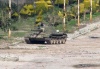 Un tanque del ejército sirio en el barrio de Bab Amr, en Homs.