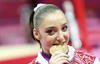 La rusa Aliya Mustafina ganó el oro en las asimétricas de gimnasia artística. (EFE)