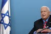 Tras una segunda oleada de atentados, en la primavera de 2002, Sharon optó por confinar a Yasser Arafat en su cuartel general de la Muqata en Ramalá, durante casi tres años, lo que motivó una declaración de condena de Naciones Unidas, Rusia y la Unión Europea. A pesar de las críticas internacionales a su política, Sharon conservó el apoyo de la población israelí, como quedó de manifiesto en las elecciones generales de enero de 2003, en las que fue reelegido por amplia mayoría.